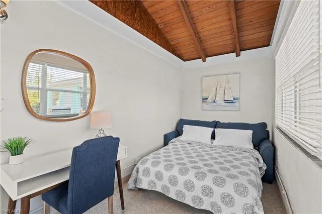 a living room with furniture a rug and a window