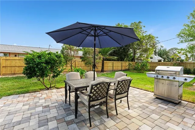 a bedroom with a bed and a chair