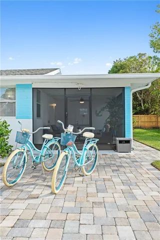 a view of a patio with table and chairs and potted plants