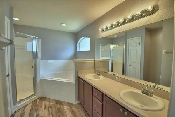 a bathroom with a sink double vanity and a mirror