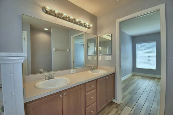 a view of a room with wooden floor