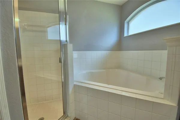 a view of a bathroom from a hallway