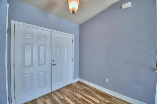 a view of an empty room with a window