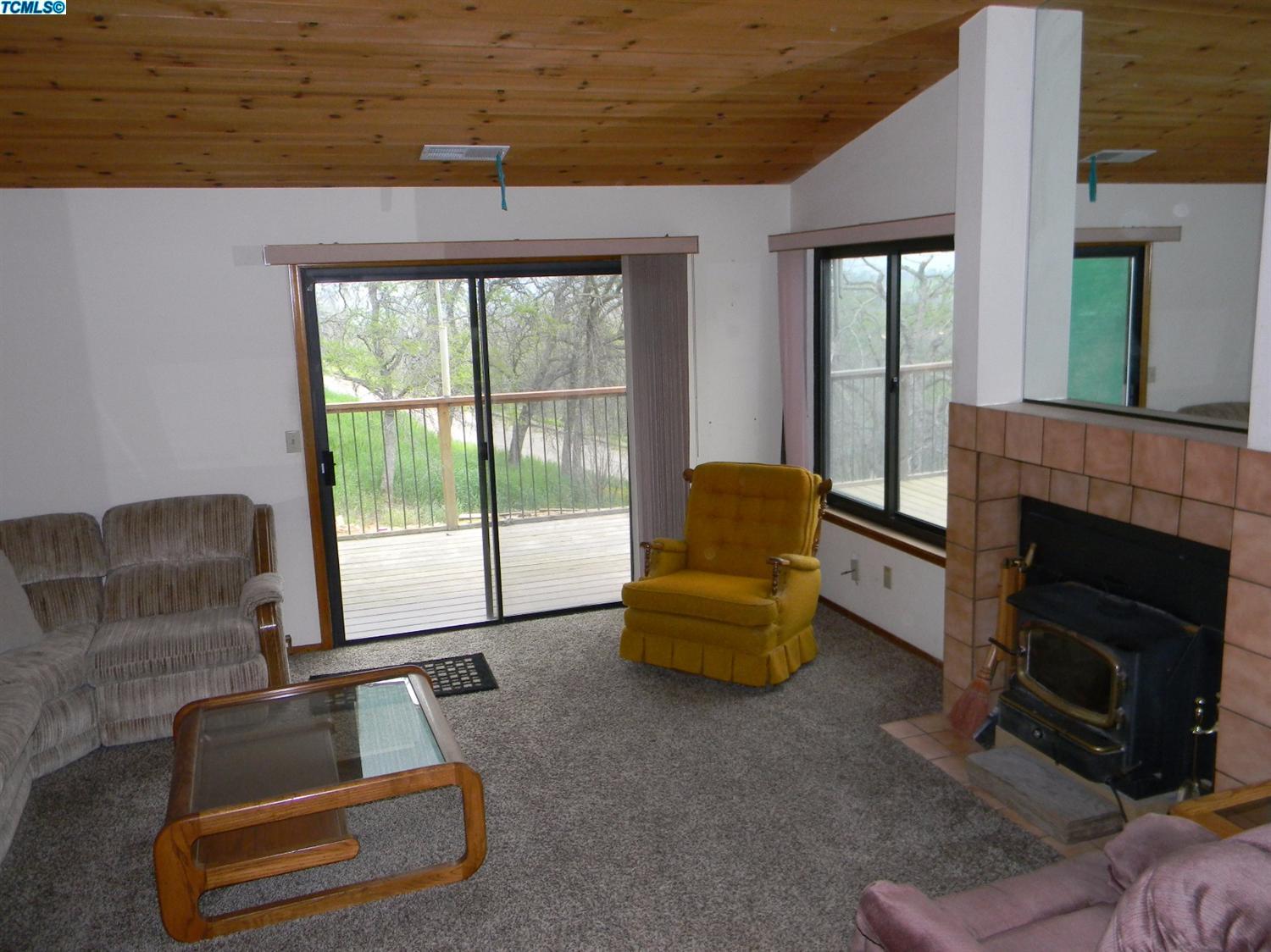 40675 Crystal Drive Three Rivers, CA 93271 - Photo 22 of 34 a living room with furniture and a fireplace