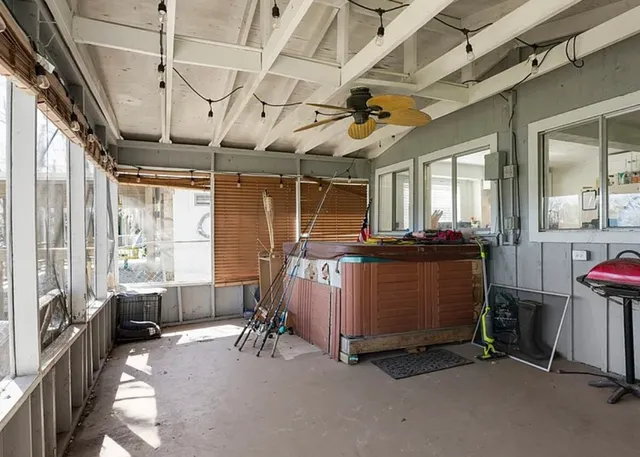 a view of a room with wooden furniture