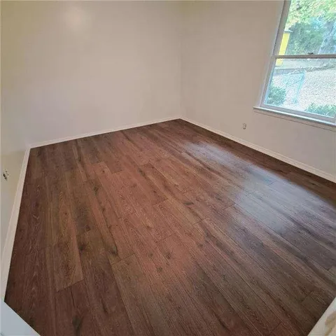 a view of front door with wooden floor