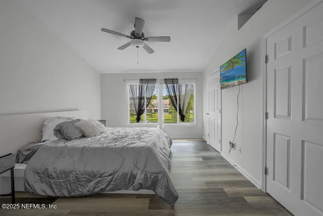 a bedroom with a bed and window