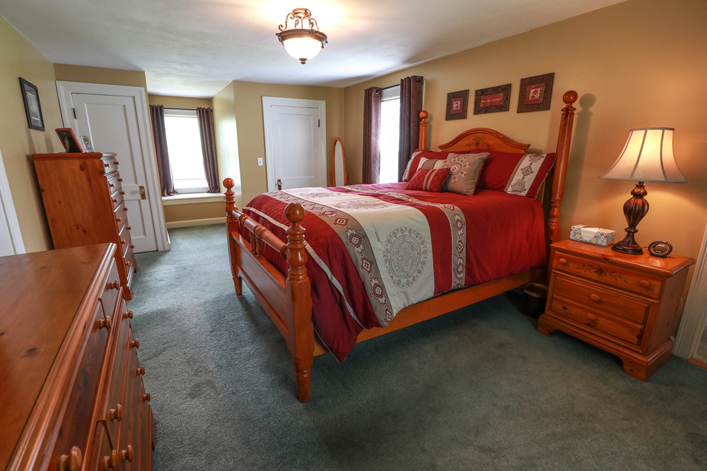 55 Mason Road Dudley, MA 01571 - Photo 13 of 19 a bedroom with a bed and wooden floor