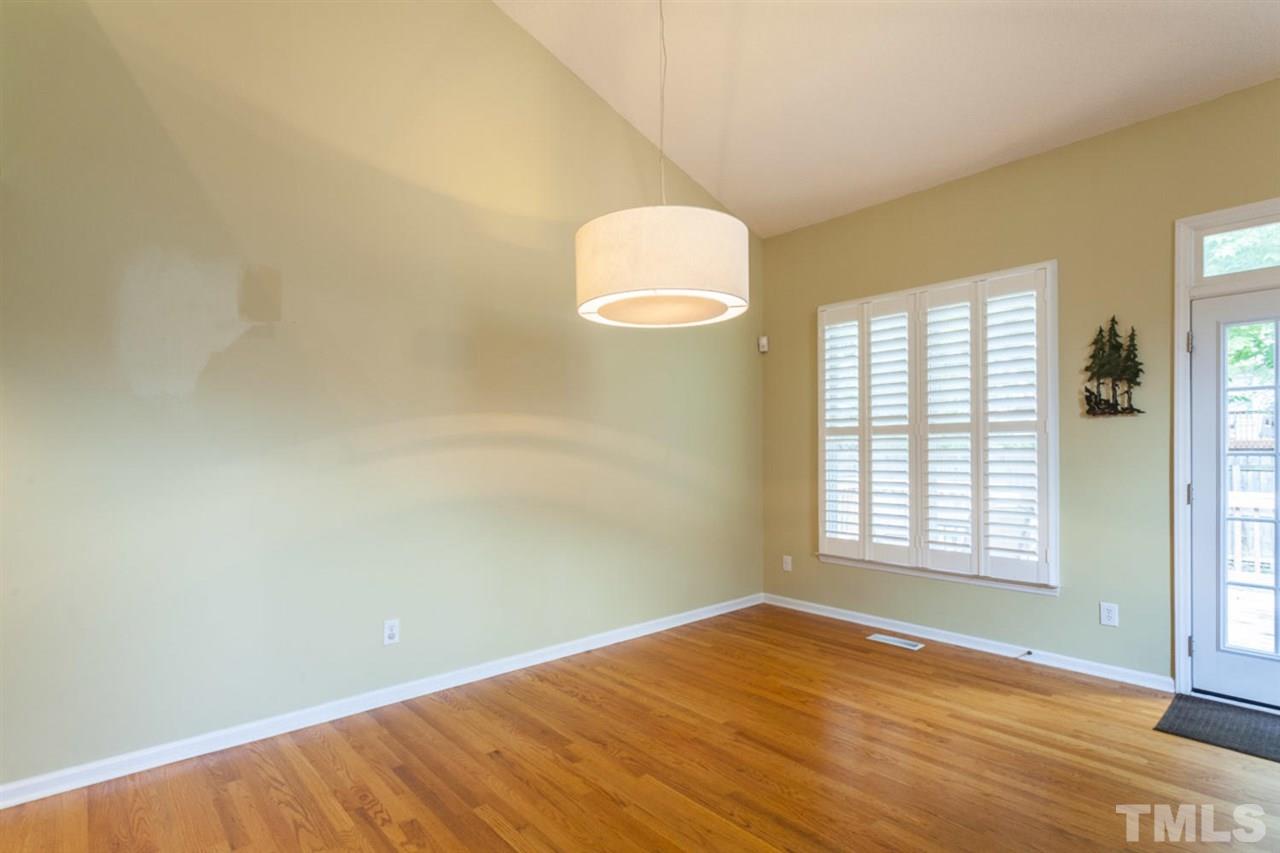 2337 Florida Court Raleigh, NC 27615 - Photo 11 of 25 a view of empty room with wooden floor and fan