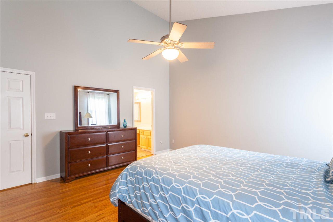 2337 Florida Court Raleigh, NC 27615 - Photo 13 of 25 a bedroom with a bed and a dresser