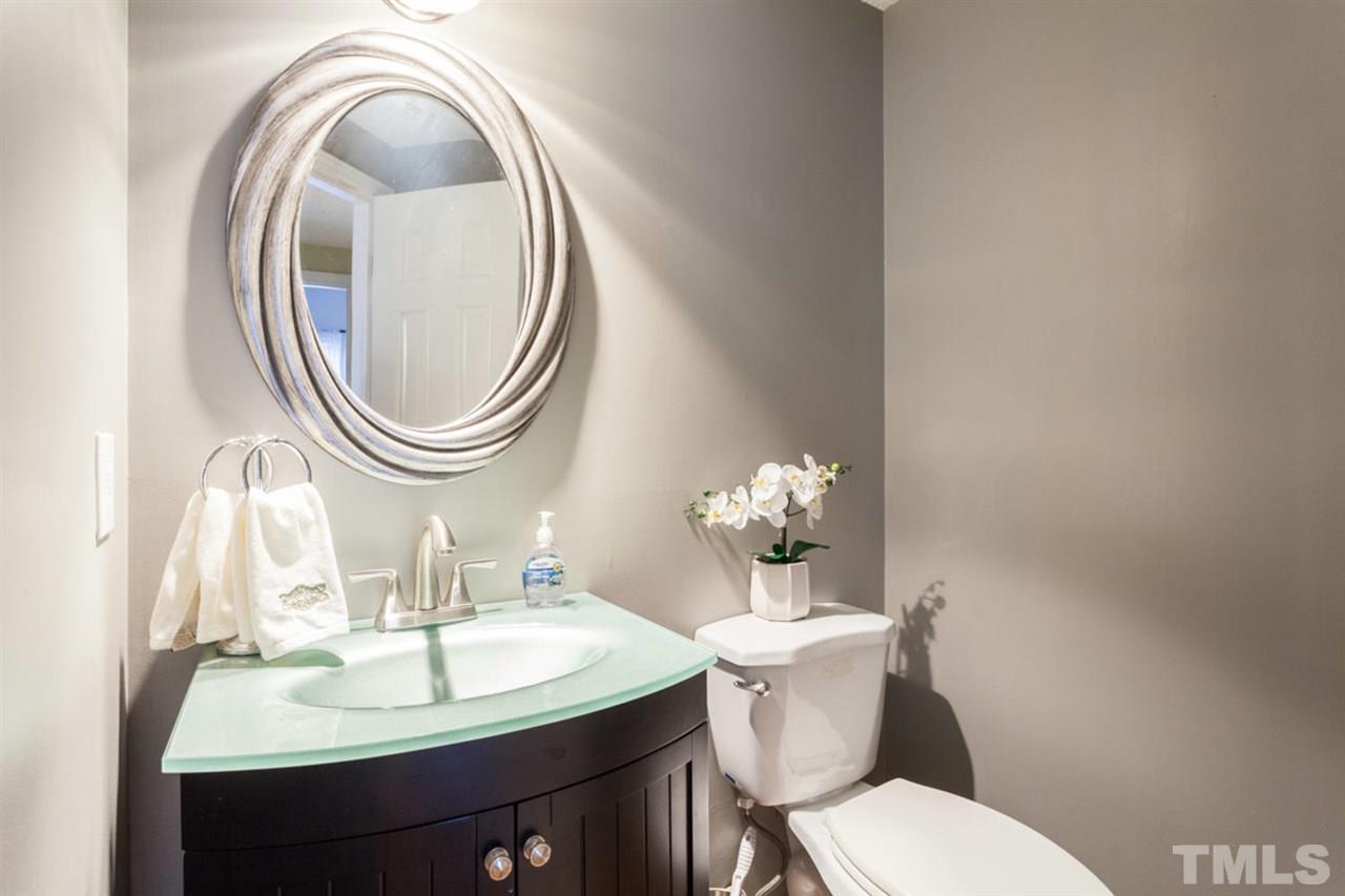 2337 Florida Court Raleigh, NC 27615 - Photo 16 of 25 a bathroom with a sink mirror and toilet