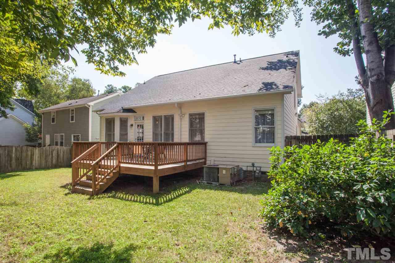 2337 Florida Court Raleigh, NC 27615 - Photo 23 of 25 a view of a house with backyard and a tree