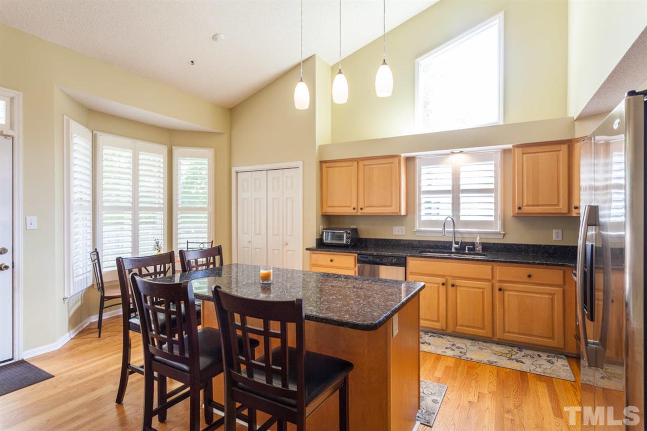 2337 Florida Court Raleigh, NC 27615 - Photo 5 of 25 a dining hall with stainless steel appliances granite countertop a dining table and chairs
