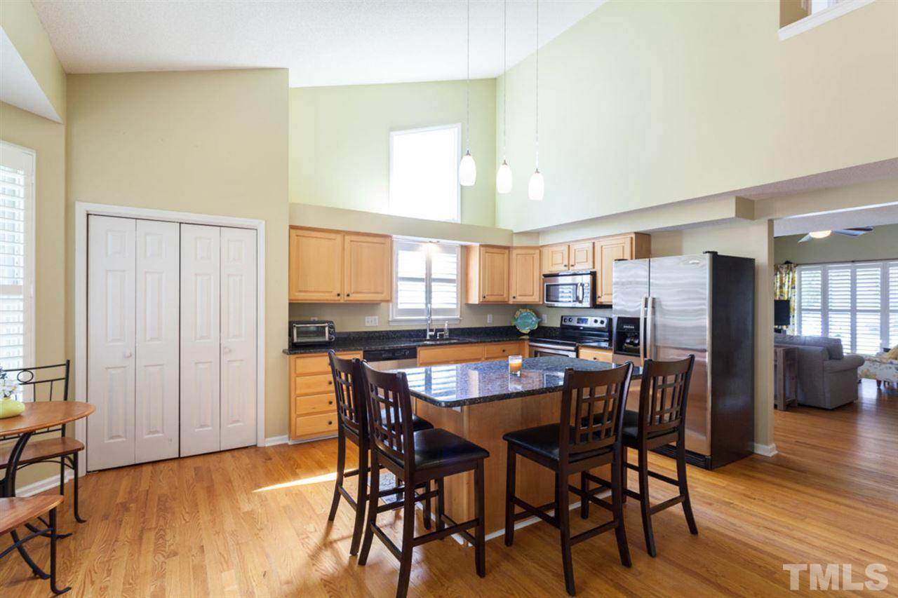 2337 Florida Court Raleigh, NC 27615 - Photo 7 of 25 a view of a dining room with furniture and wooden floor