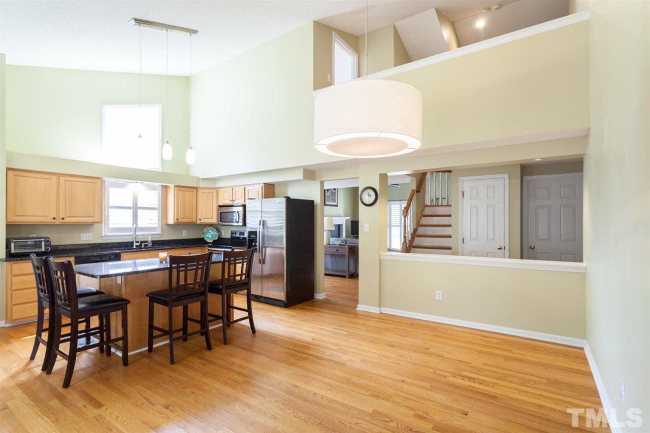 2337 Florida Court Raleigh, NC 27615 - Photo 9 of 25 a view of a dining room with furniture and wooden floor