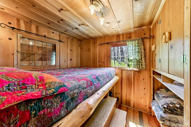 a bed room with wooden floor