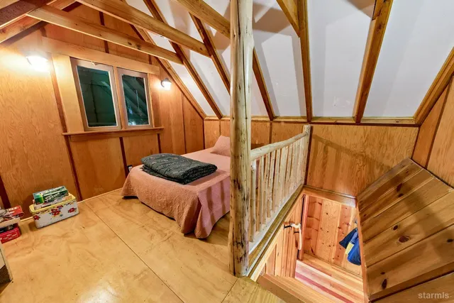 a bed room with a bed and a window