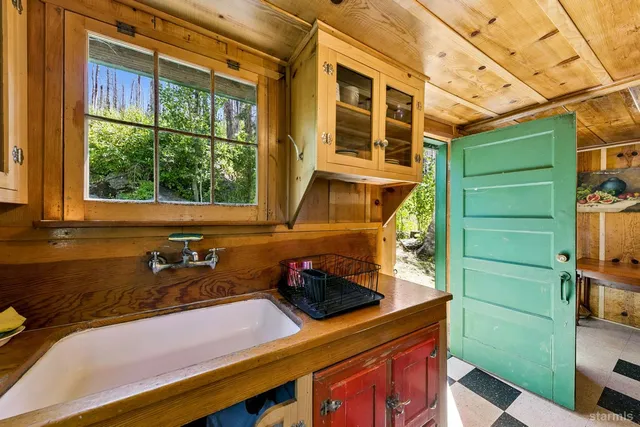 a bathroom with a sink and a window