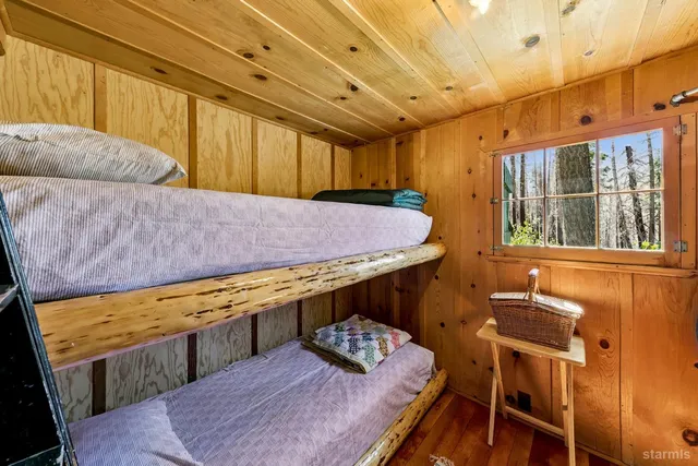 a balcony with furniture and wooden floor