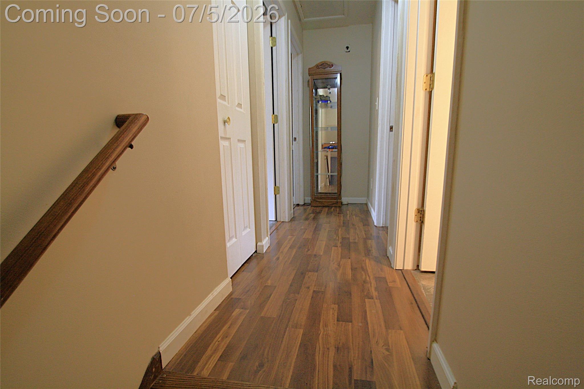 12403 Willard Road Montrose, MI 48457 - Photo 24 of 30 Hallway featuring dark wood finished floors and baseboards