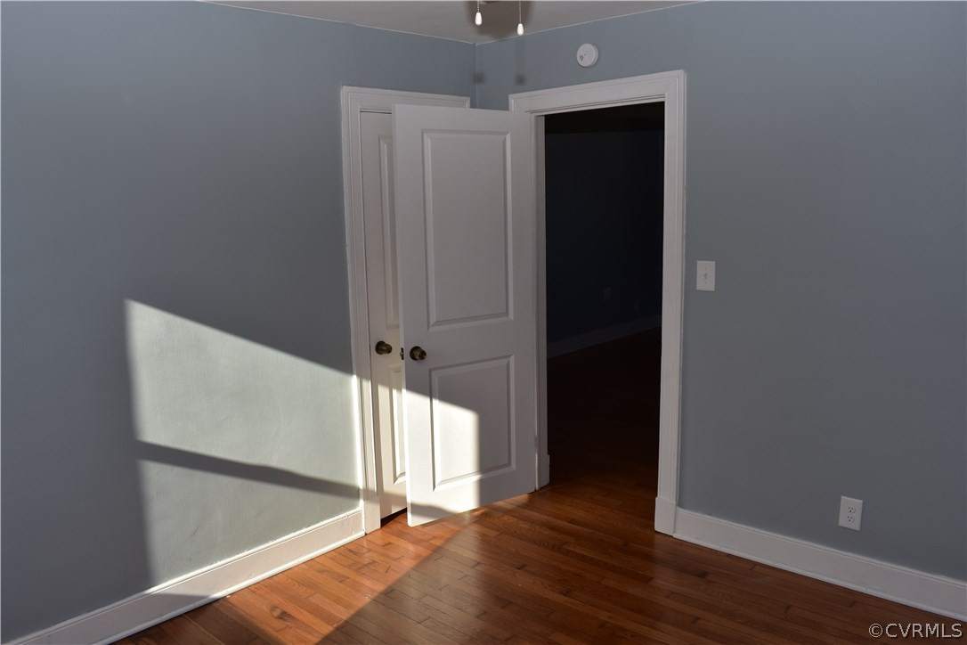 550 Riverview Road Colonial Heights, VA 23834 - Photo 11 of 26 an empty room with wooden floor and a window