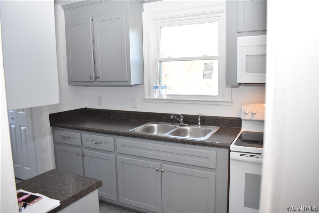 550 Riverview Road Colonial Heights, VA 23834 - Photo 15 of 26 a kitchen with sink cabinets and window