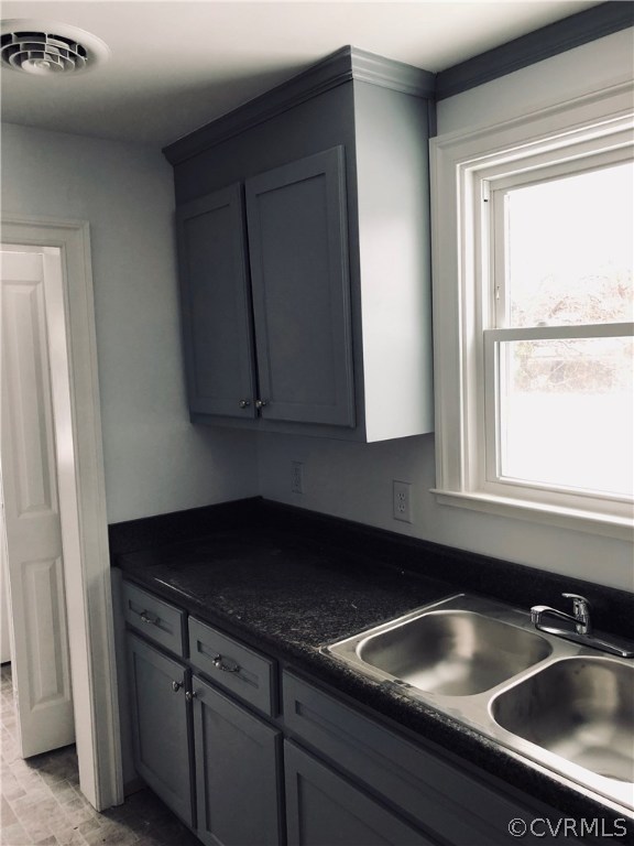 550 Riverview Road Colonial Heights, VA 23834 - Photo 18 of 26 a kitchen with a sink cabinets and a window