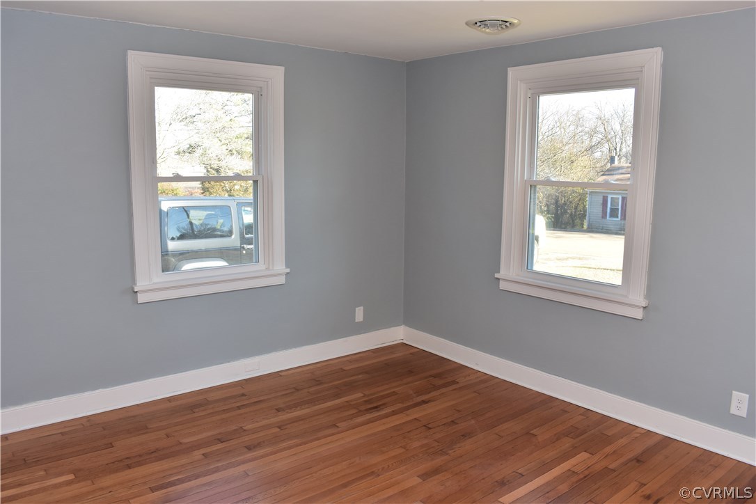 550 Riverview Road Colonial Heights, VA 23834 - Photo 4 of 26 a view of an empty room with wooden floor and a window