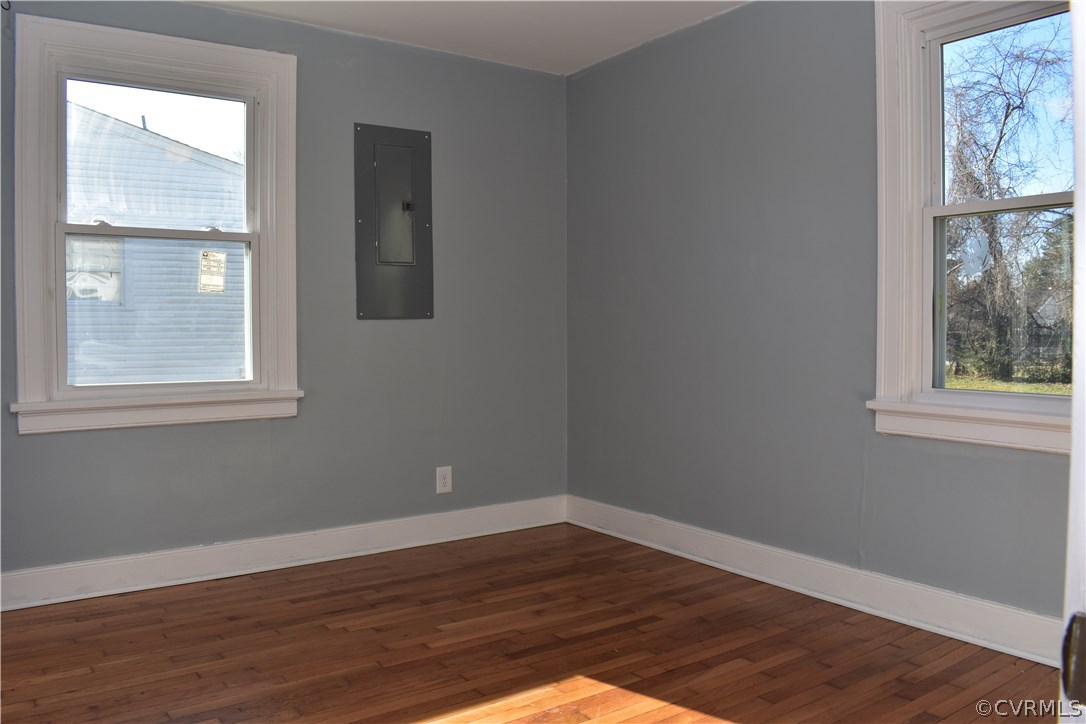 550 Riverview Road Colonial Heights, VA 23834 - Photo 7 of 26 a view of an empty room with wooden floor and a window