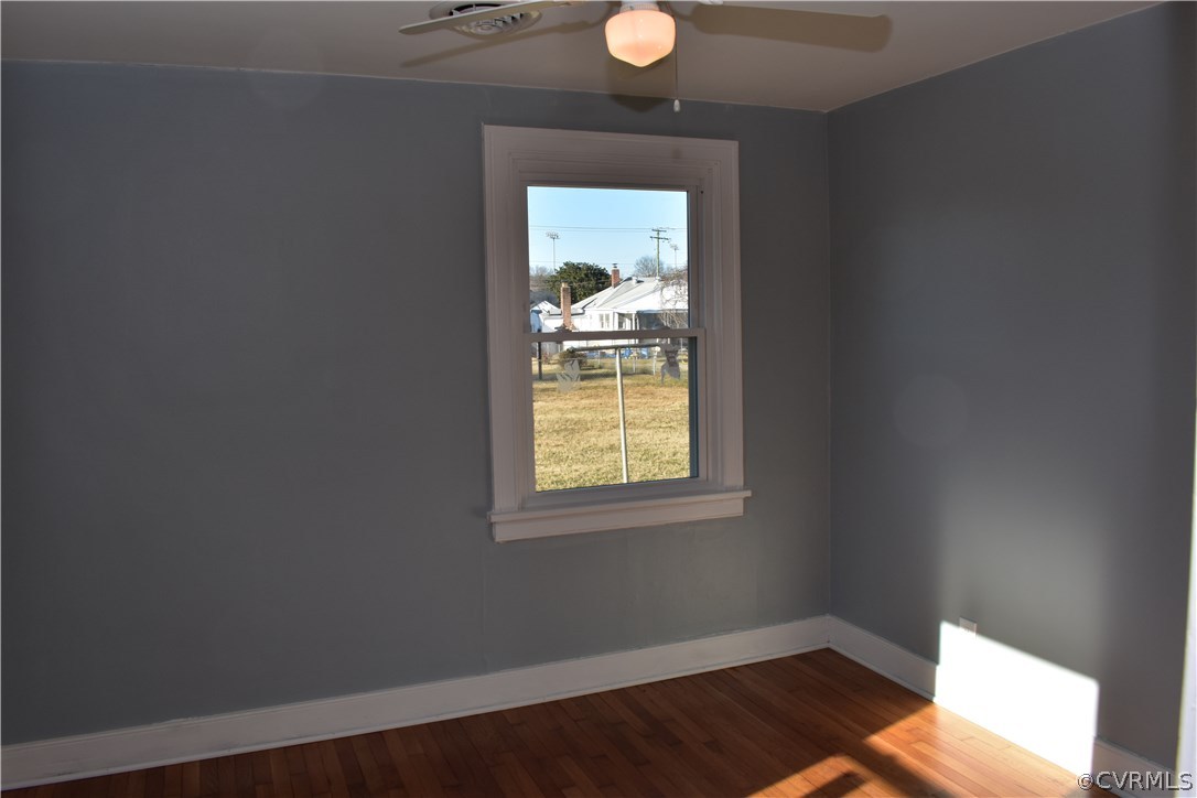 550 Riverview Road Colonial Heights, VA 23834 - Photo 8 of 26 a view of an empty room with wooden floor and a window