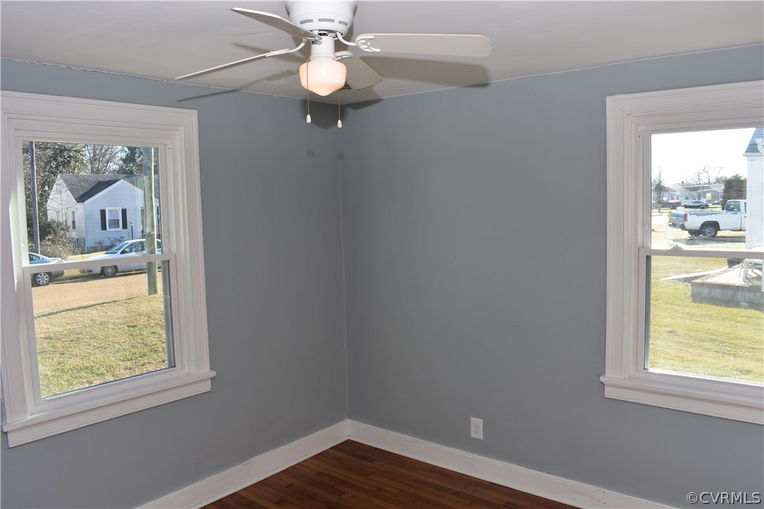 550 Riverview Road Colonial Heights, VA 23834 - Photo 10 of 26 a view of an empty room with a window and wooden floor