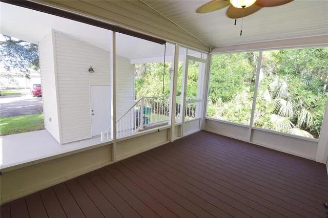 a view of room with window and wooden floor