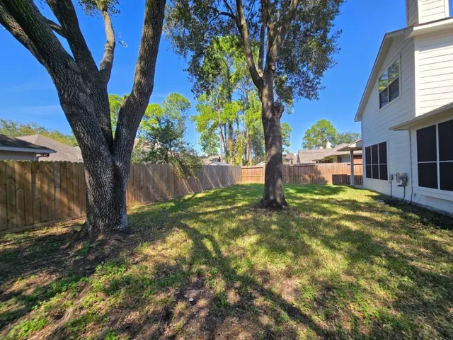 a backyard of a house with lots of green space