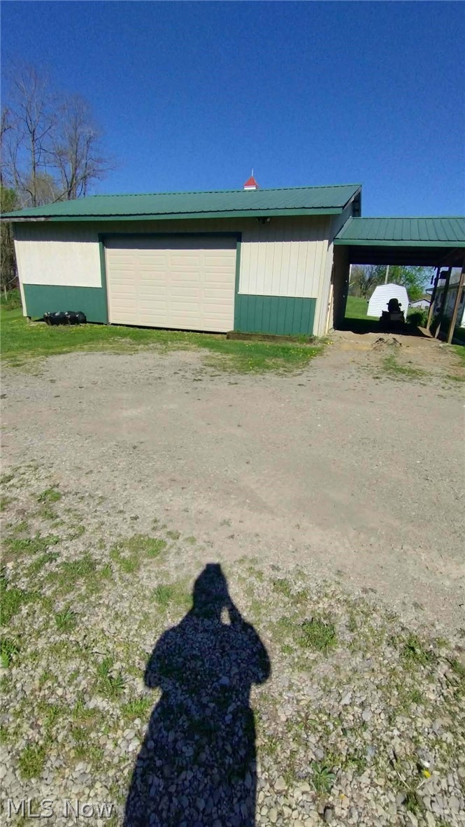 23033 Cadiz Road Freeport, OH 43973 - Photo 2 of 31 Detached garage featuring a carport