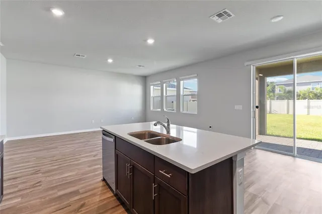 a bathroom with a sink a mirror and a shower
