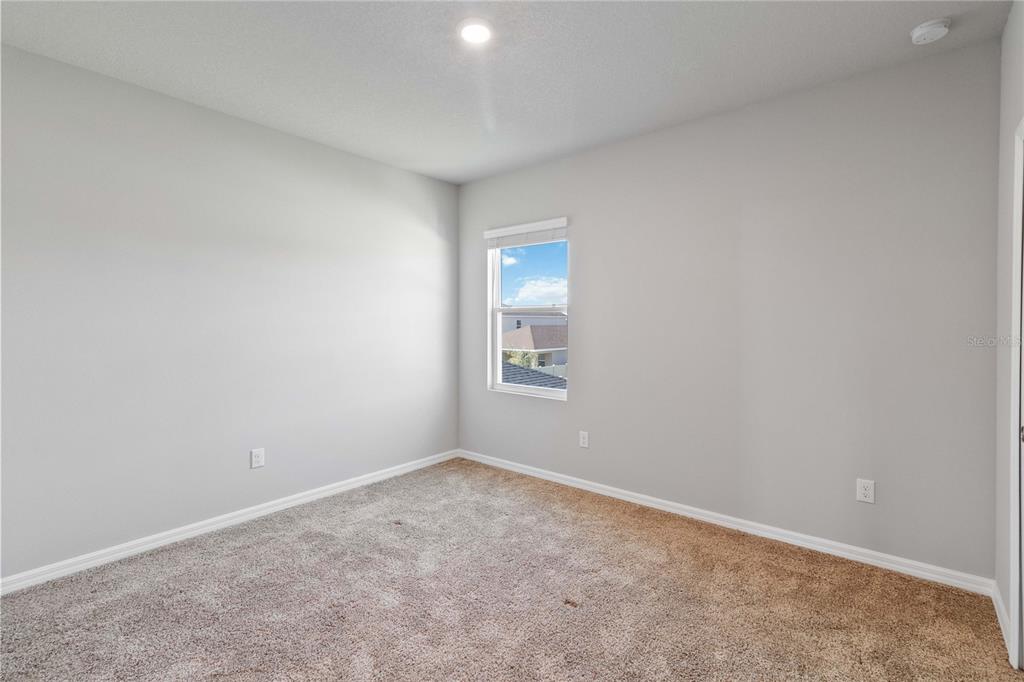 5617 Bungalow Grove Court Palmetto, FL 34221 - Photo 19 of 31 a view of an empty room with a window