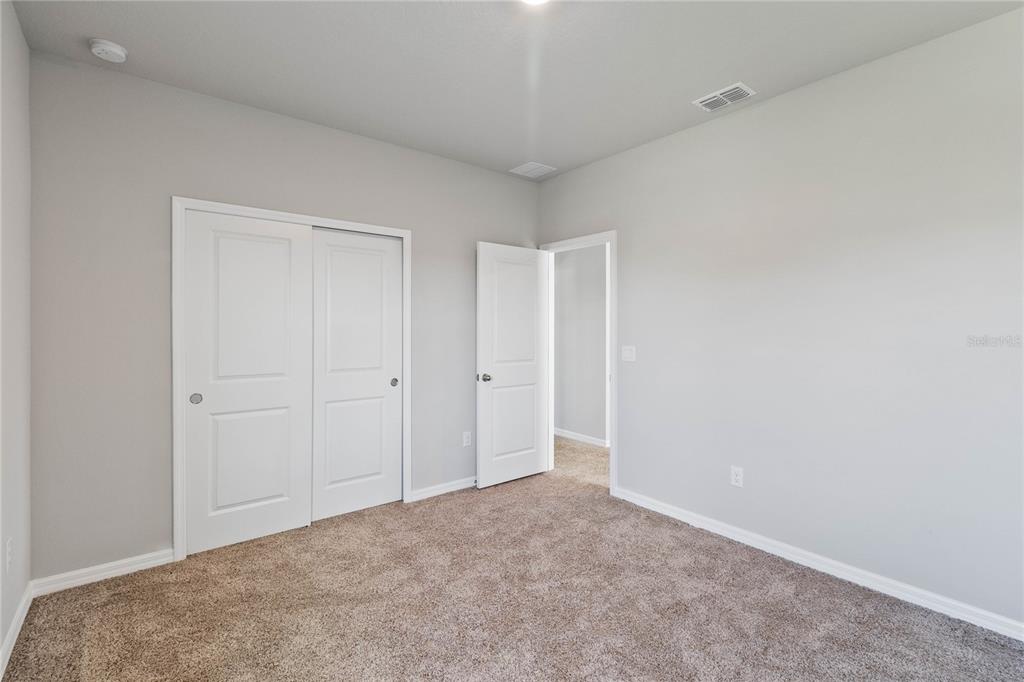5617 Bungalow Grove Court Palmetto, FL 34221 - Photo 20 of 31 a view of an empty room and closet area