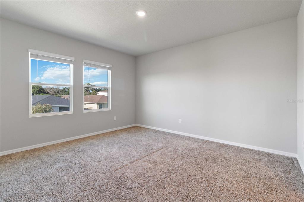 5617 Bungalow Grove Court Palmetto, FL 34221 - Photo 21 of 31 an empty room with windows