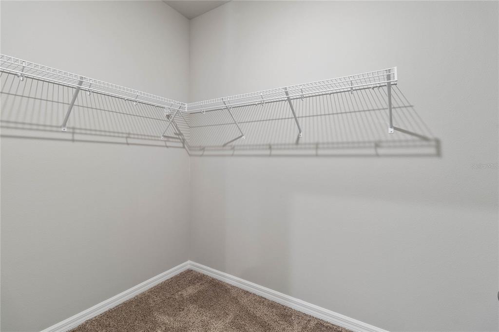 5617 Bungalow Grove Court Palmetto, FL 34221 - Photo 24 of 31 a view of a room with racks on the wall