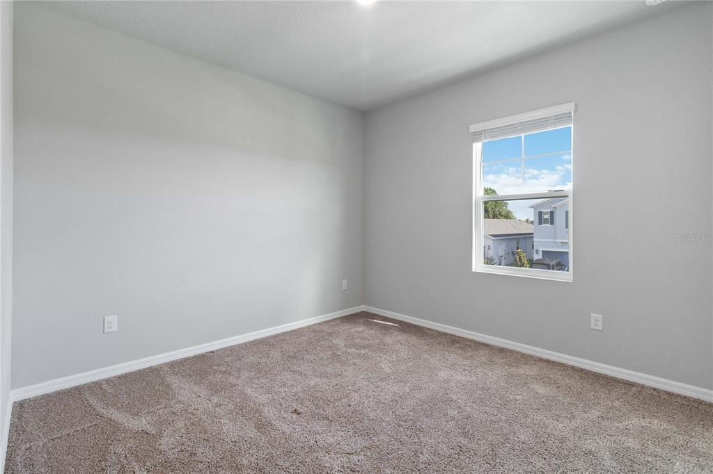 5617 Bungalow Grove Court Palmetto, FL 34221 - Photo 27 of 31 an empty room with a window
