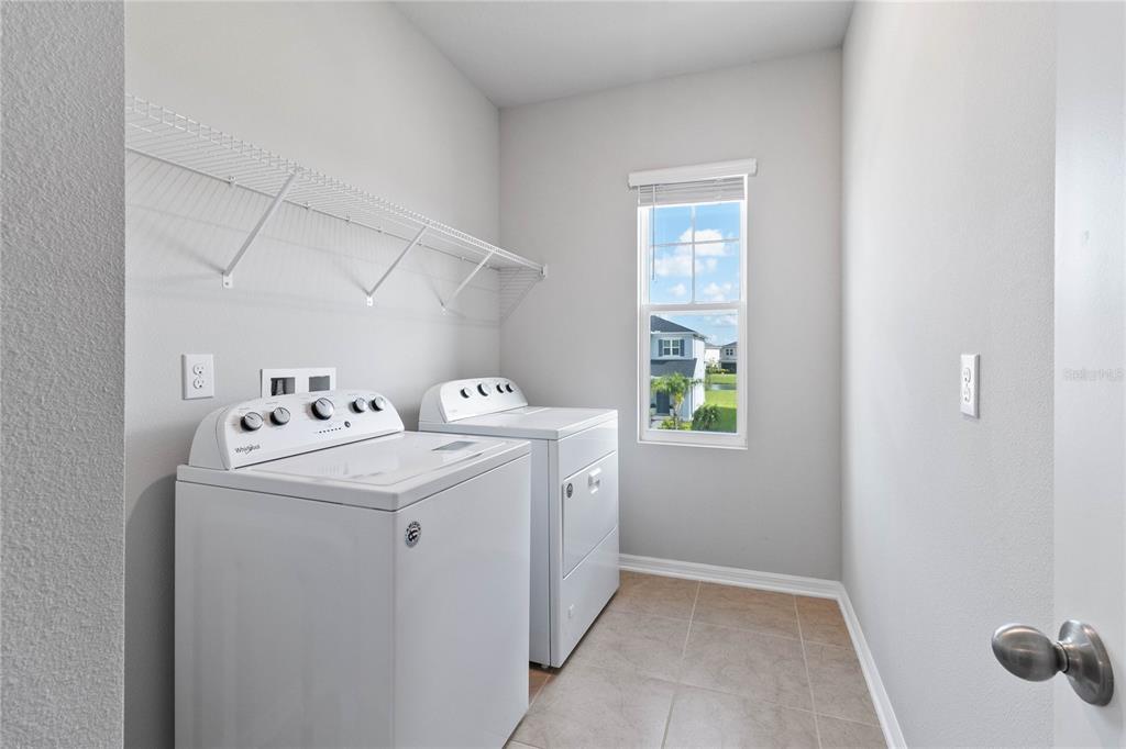 5617 Bungalow Grove Court Palmetto, FL 34221 - Photo 29 of 31 a utility room with dryer and washer