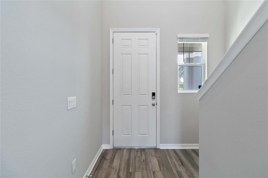 5617 Bungalow Grove Court Palmetto, FL 34221 - Photo 7 of 31 wooden floor in an empty room