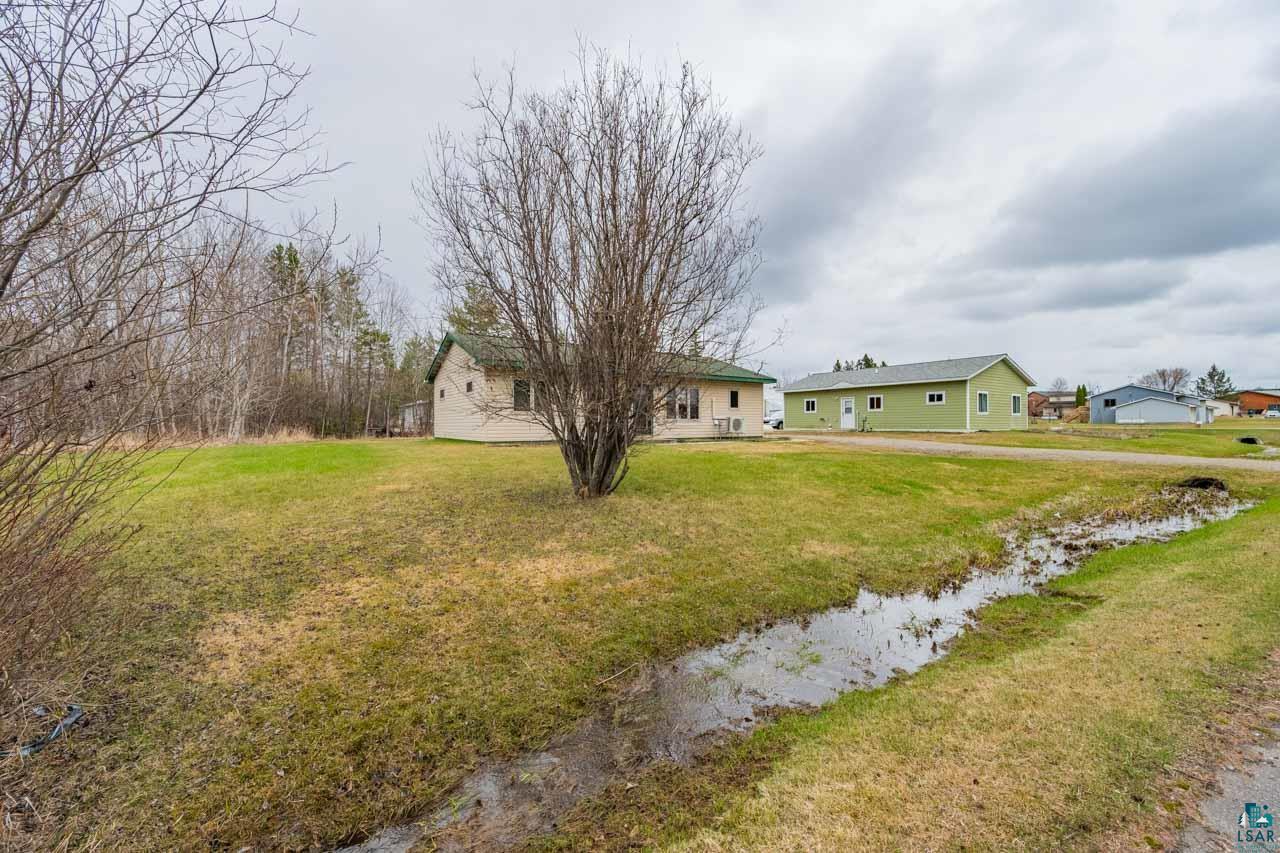 228 3rd Street Southeast Cook, MN 55723 - Photo 19 of 30 Expansive grassy lot featuring two detached structures