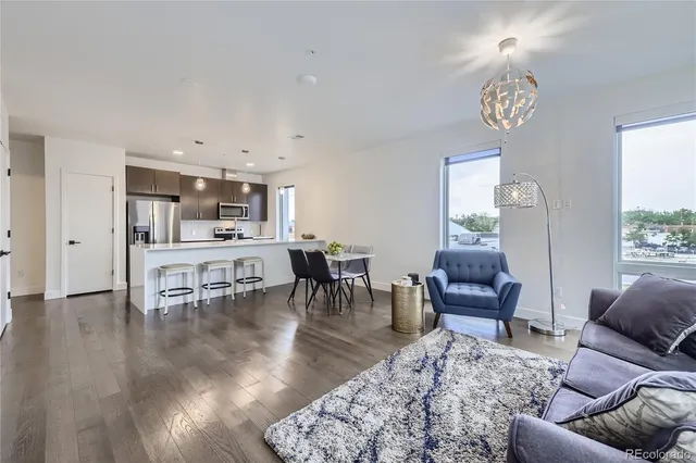 a living room with furniture and a table