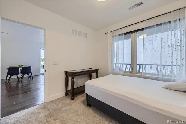 a bedroom with a bed and a table