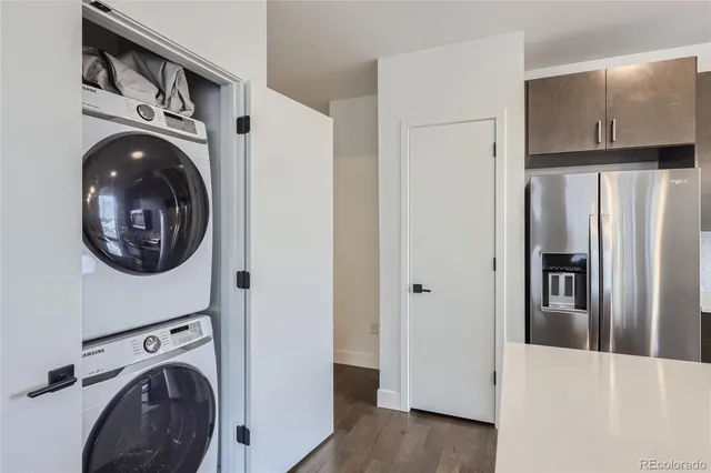 a view of a hallway with washer and dryer