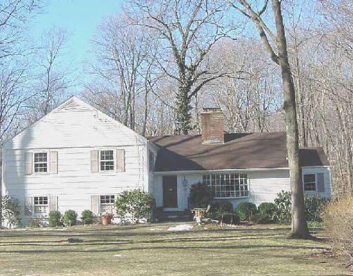 63 Little Brook Road Wilton, CT 06897 - Photo 1 of 1 a front view of house with a garden