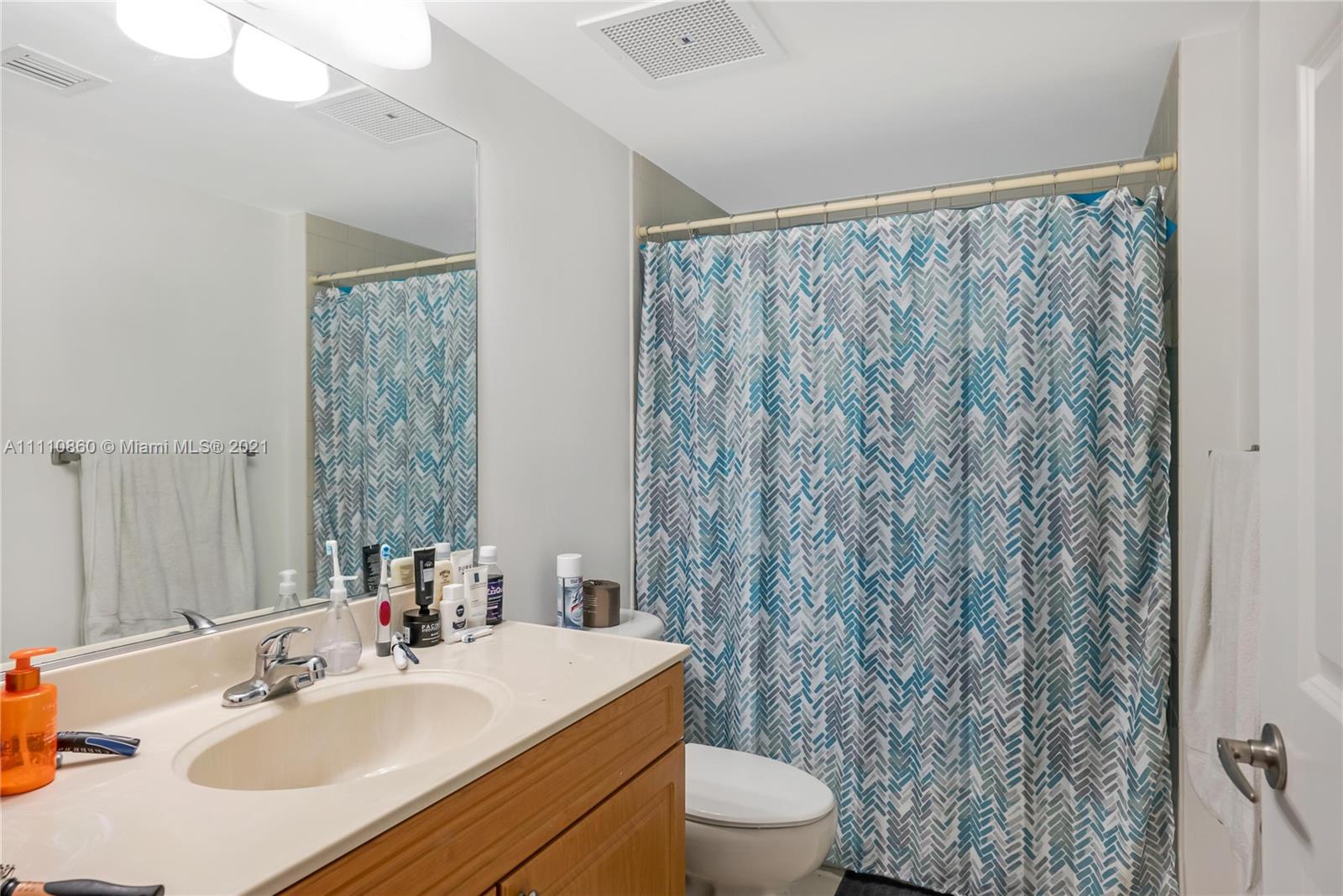 900 Southwest 8th Street, Unit 904 Miami, FL 33130 - Photo 7 of 12 a bathroom with a sink toilet and shower