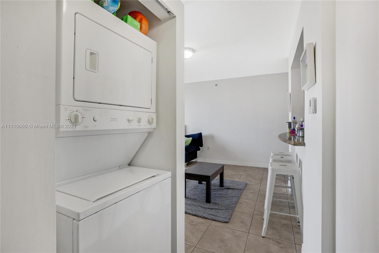 900 Southwest 8th Street, Unit 904 Miami, FL 33130 - Photo 8 of 12 a room with a washer and dryer