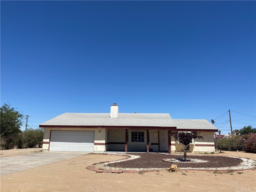 13425 El Rio Road Victorville, CA 92392 - Photo 1 of 1 a front view of a house with a porch